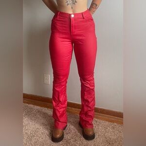 Red, stretchy jeans. Flared at the bottom.
